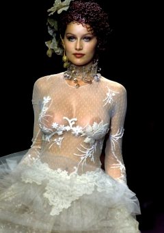 French actress and model Laetitia Casta nude boobs under see through dress runway photo